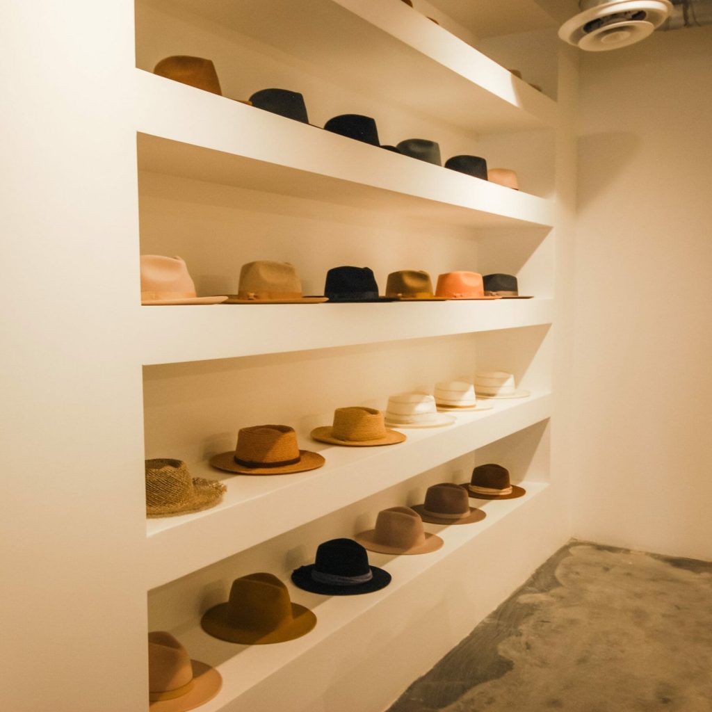 hats on built in shelving unit - retail construction details